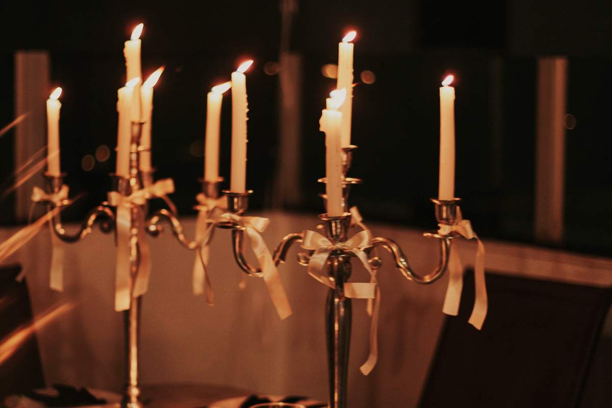 The Coalhouse set for a private dinner: one long table, linen and candles.